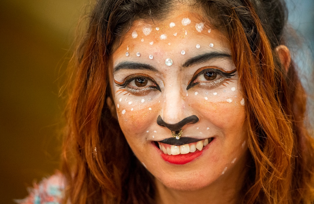 (Rick Egan  |  The Salt Lake Tribune)       Artist, Consu Nikolazza paints her face to advertise her face painting at the booth where she sells her art at the second annual Made in Utah Winter Fest at The Gateway.  The free festival includes local artists, musicians, artisans, breweries, distilleries, food trucks, and other local businesses, to help promote shopping locally for holidays. The Utah Winter Fest continues December 21 & 22. Sunday, Dec. 15, 2019.
