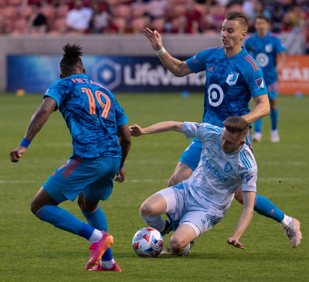 (Francisco Kjolseth | The Salt Lake Tribune) Real Salt Lake defender Andrew Brody (2) is pressured by Minnesota United defender Romain Metanire (19) and Minnesota United midfielder Jan Gregus (8) in MLS action between Real Salt Lake and Minnesota United FC at Rio Tinto Stadium in Sandy, on Saturday, May 29, 2021.