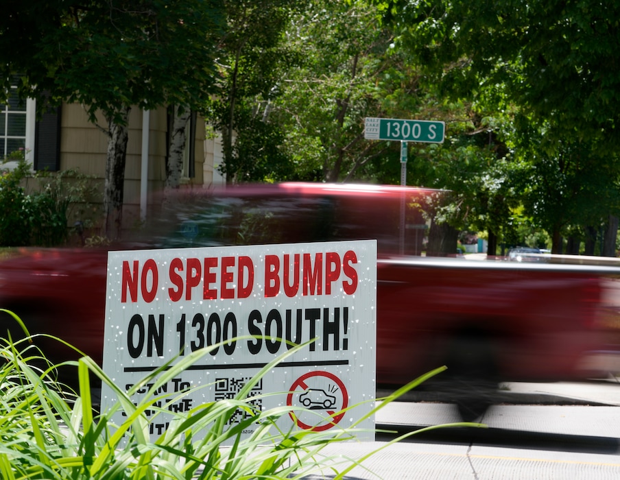 (Leah Hogsten | The Salt Lake Tribune) Homeowners along 1300 South between Foothill Drive and 1700 East have placed yard signs that call for opposing a plan to install speed bumps, Thursday, June 15, 2023.