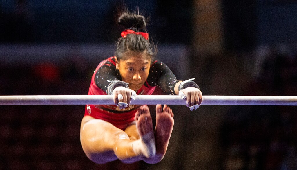 (Rick Egan | The Salt Lake Tribune) Alini Sabado competes on the uneven bars for Utah in the Best of Utah gymnastics meet at the Maverik Center on Saturday, Jan. 9, 2021.