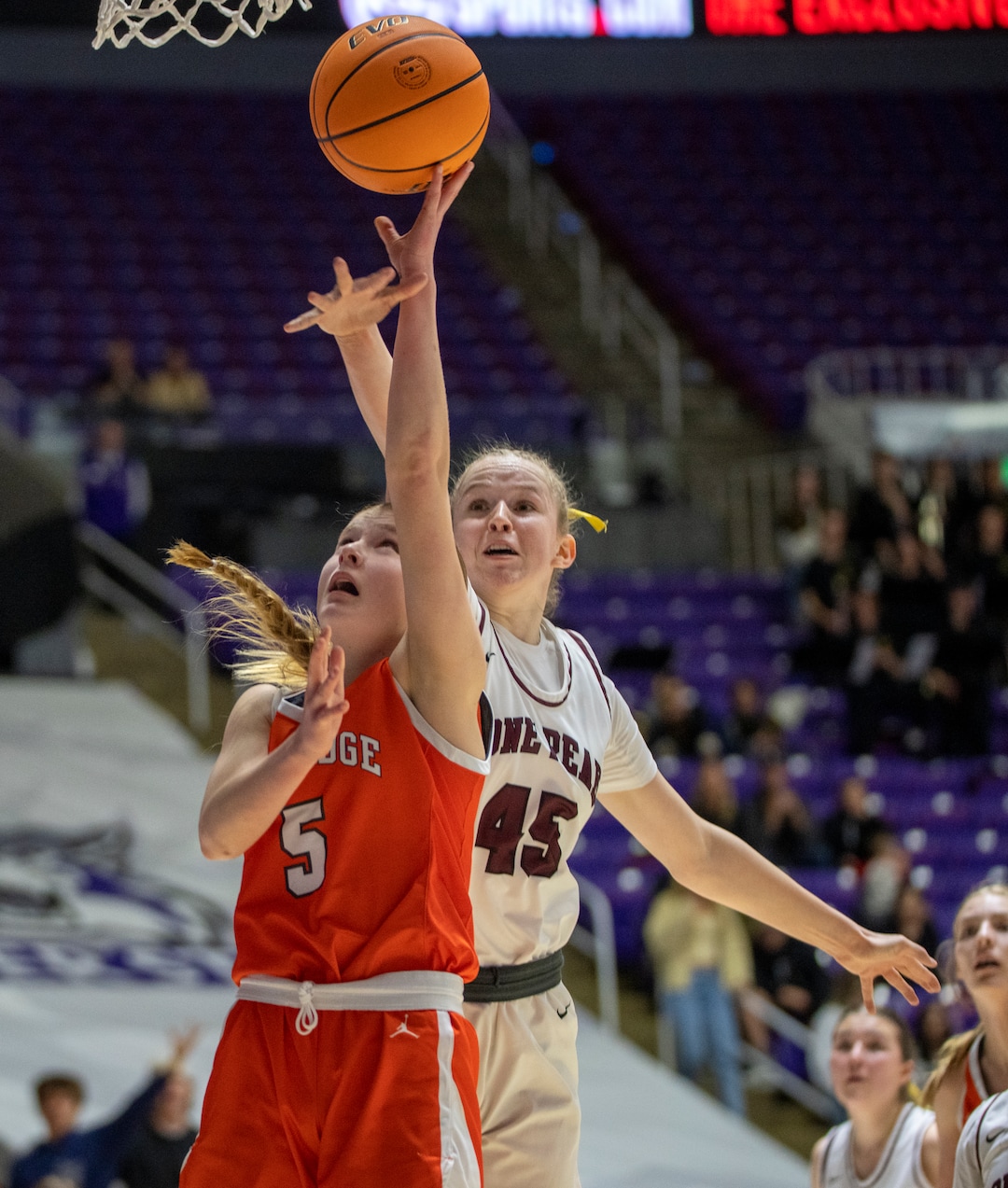(Rick Egan | The Salt Lake Tribune) Cambree Blackham (5) shoots as Sarah Bartholomew (45) defends in the 6A girls Championship Game between Skyridge and Lone Peak, at Weber State, on Saturday, March 4, 2023.