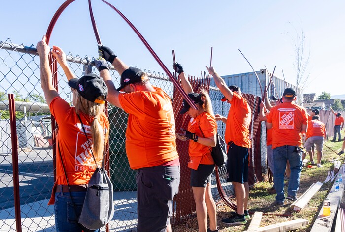 (Rick Egan | The Salt Lake Tribune) More than 600 volunteers, led by Home Depot employees, help spruce up the Sunrise Metro and Freedom Landing apartments in Salt Lake City on Wednesday, Sept. 21, 2022.