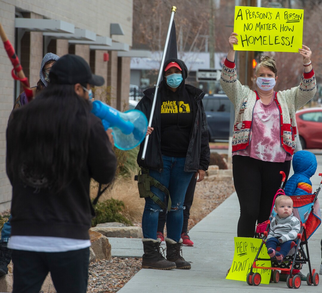 (Rick Egan | The Salt Lake Tribune) Black Lives Matter and other groups protest the way the health department has been forcing people experiencing homelessness to move in the middle of a pandemic and the coldest time of the year, infront of the Salt Lake Public Health Center onFriday, Dec. 18, 2020.