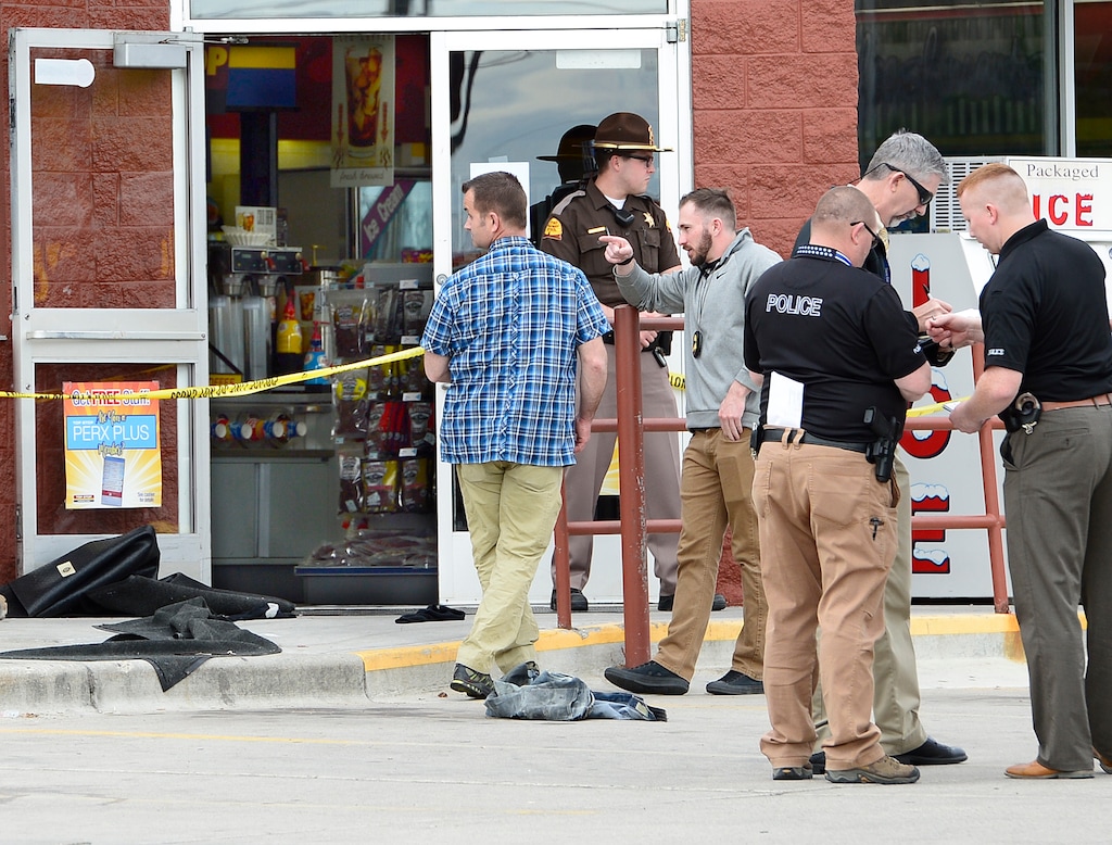 Scott Sommerdorf | The Salt Lake Tribune
Four police officers were taken to the hospital after trying to save the life of a man who poured gasoline over himself in the bathroom of the Chevron Top Stop at 300 West and 200 South in Kaysville, Thursday, April 5, 2018. The man was taken in a helicopter to UofU Medical Center. A piece of clothing - perhaps a pair of pants - lays on the cement outside the convenience store as police conduct their investigation.