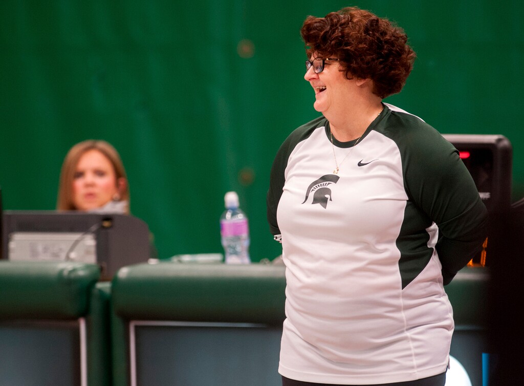 FILE - In this Feb. 19, 2016 file photo, former Michigan State University gymnastics head coach Kathie Klages reacts during the womens gymnastic's meet in East Lansing, Mich. Former Michigan State gymnastics coach Klages was charged Thursday, Aug. 23, 2018  with lying to police amid an investigation into the school's handling of sexual abuse complaints against former sports doctor Larry Nassar.  (Sundeep Dhanjal/The State News via AP File)
