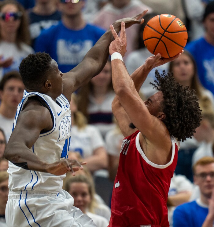 (Rick Egan | The Salt Lake Tribune)  Brigham Young Cougars forward Fousseyni Traore (45) blocks a shot by South Dakota Coyotes guard Damani Hayes (2), in basketball action between the Brigham Young Cougars and the South Dakota Coyotes, at Vivint Arena, in Salt Lake City, on Saturday, Dec. 3, 2022.
