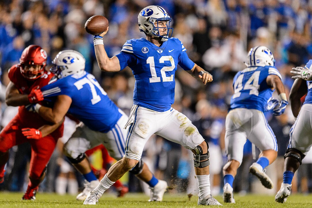 (Trent Nelson | The Salt Lake Tribune)  Brigham Young Cougars quarterback Tanner Mangum (12) throws the ball as BYU hosts Utah, NCAA football in Provo, Saturday September 9, 2017.