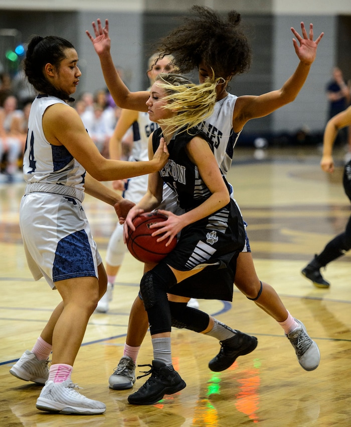 (Steve Griffin  |  The Salt Lake Tribune)  Riverton guard Hailee Anderson gets trapped by the swarming Copper Hills' defense during the Riverton versus Copper Hills girl's basketball game at Cooper Hill s High School in West Jordan Thursday February 1, 2018.