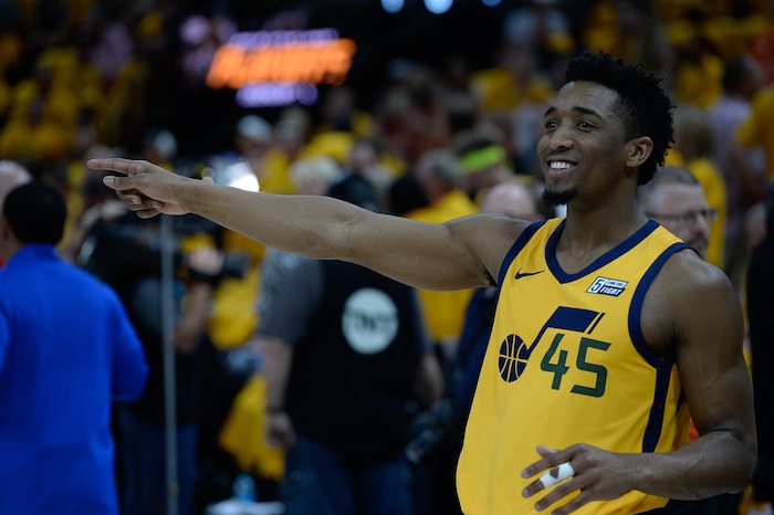(Francisco Kjolseth | The Salt Lake Tribune) Utah Jazz guard Donovan Mitchell (45) jokes around with the team as they warm up for their game against the Houston Rockets in Game 4 of the NBA playoffs at the Vivint Smart Home Arena Sunday, May 6, 2018 in Salt Lake City.
