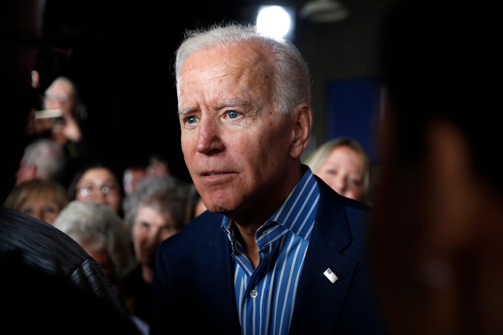 (Charlie Neibergall | The Associated Press) In this May 1, 2019, photo, former Vice President and Democratic presidential candidate Joe Biden greets audience members during a rally in Iowa City, Iowa. Biden’s candidacy didn’t scare off any of his rivals, who lined up one after another in a race they believed was truly up for grabs. Did they underestimate him? Biden’s political liabilities are many, but he’s quickly emerged as an overwhelming front-runner who’s dominating the race for money and political oxygen in the crowded 2020 Democratic contest.