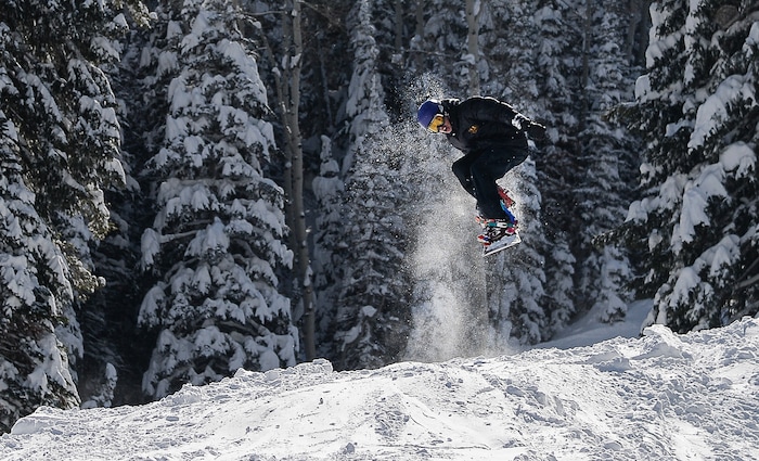 (Francisco Kjolseth  |  The Salt Lake Tribune)  A snowboarder takes in the soft conditions on a blue bird day at Solitude Mountain Resort following a series of storms that have piled on the inches of snow in the high country on Thursday, Feb. 7, 2019.