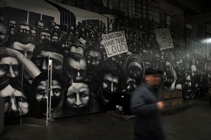 Leah Hogsten | The Salt Lake Tribune
Silencerco's motto of "guns don't have to be loud" can be found throughout the manufacturing facility, including this mural near the research and development lab. Silencerco is one of the country's largest manufacturers of silencer for guns of all kinds, Friday, May 28, 2017.