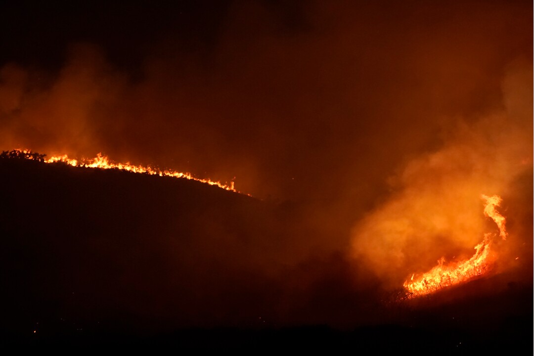 (George Frey  |  for The Salt Lake Tribune) A wildfire burns on Traverse Mountain above Lehi, Uta,h on June 28th, 2020.