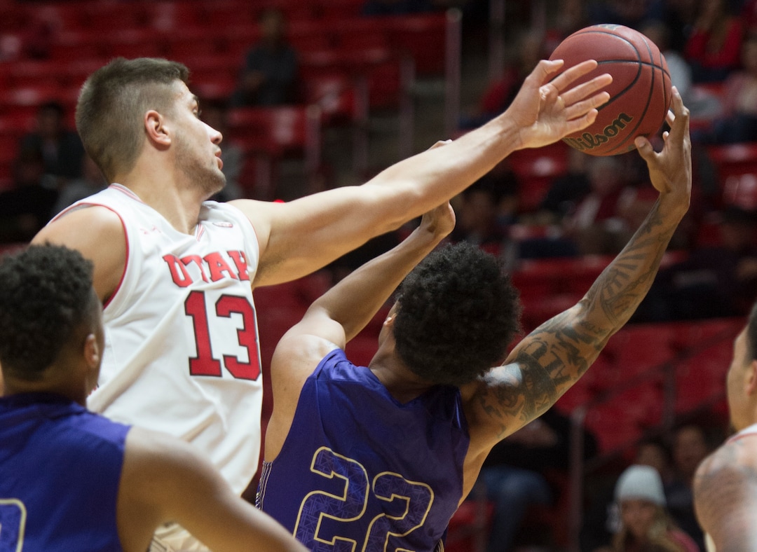 (Rick Egan  |  The Salt Lake Tribune)    Utah Utes forward Novak Topalovic (13) foes for the ball along with College of Idaho forward Keun Palu-Thompson (22), in basketball action, between the Utah Utes and the College of Idaho Yotes at the Jon M. Huntsman Center, Thursday, Nov. 1, 2018.