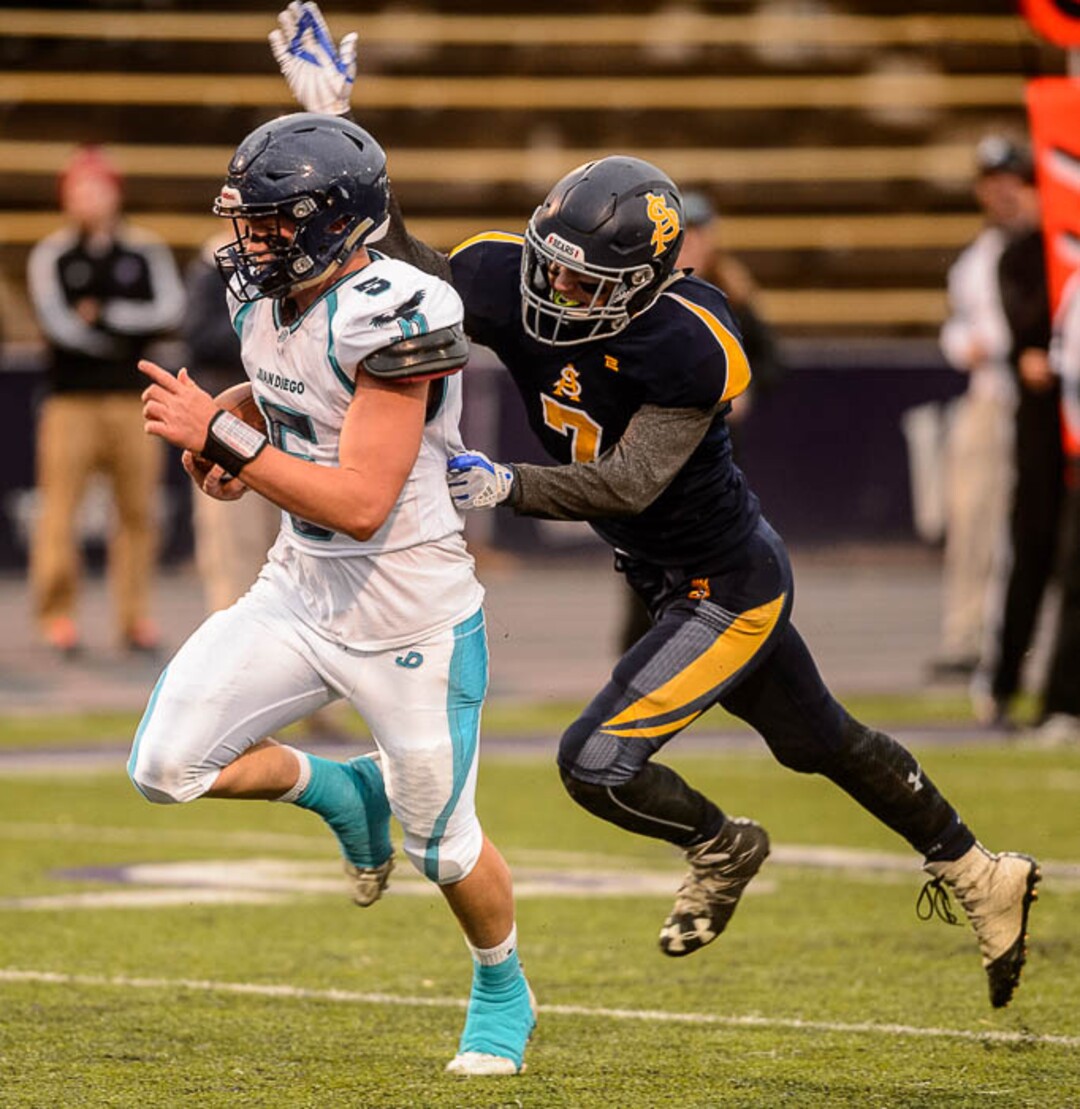 (Trent Nelson | The Salt Lake Tribune)  Summit Academy's Hunter Housel strips the ball from Juan Diego's Peyton Seim, resulting in a turnover. Summit Academy faces Juan Diego High School in a class 3A state semifinal football game at Weber State University's Stewart Stadium, Saturday November 4, 2017.