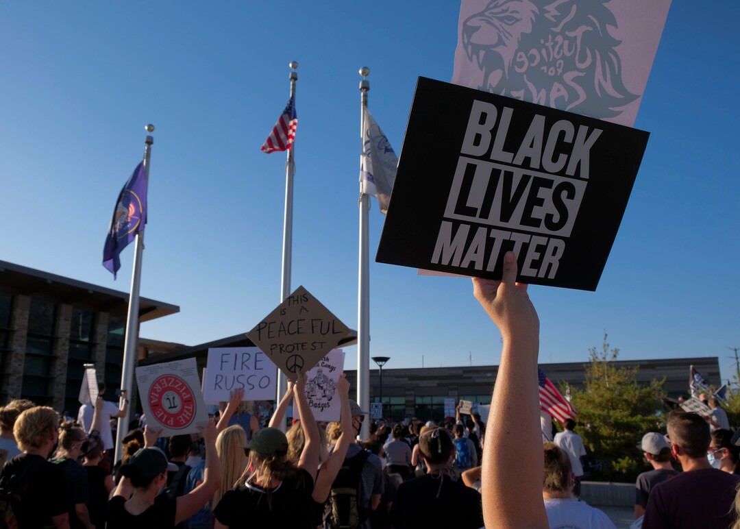 (Leah Hogsten  |  The Salt Lake Tribune) Five days after after nine protesters were arrested during a peaceful rally in memory of Zane James that turned into a violent clash with Cottonwood Heights officers, demonstrators gathered outside the police station Friday to denounce CHPD's actions and its officers for inciting the violence.