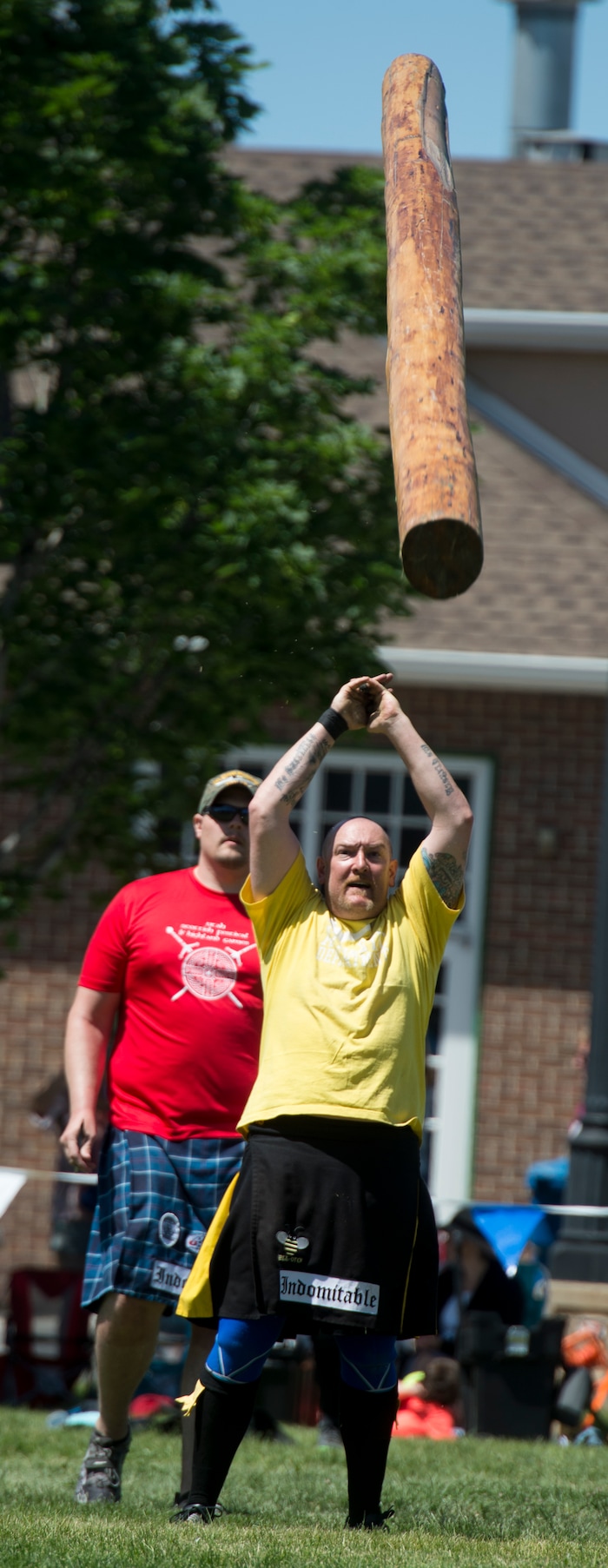 (Rick Egan  |  The Salt Lake Tribune)      Justin Lees competes in the caber toss, at the 44th annual Utah Scottish Festival and Highland Games at the Utah State Fairgrounds, Sunday, June 10, 2018.