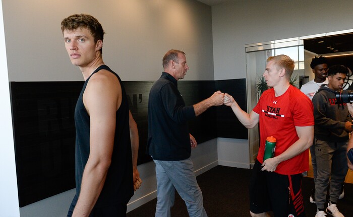 (Francisco Kjolseth  |  The Salt Lake Tribune)  Utah basketball player Jayce Johnson, left, and Parker Van Dyke are greeted by Utah basketball coach Larry Krystkowiak, center, during media day at the Ute basketball practice facility on Wed. Sept. 26, 2018.