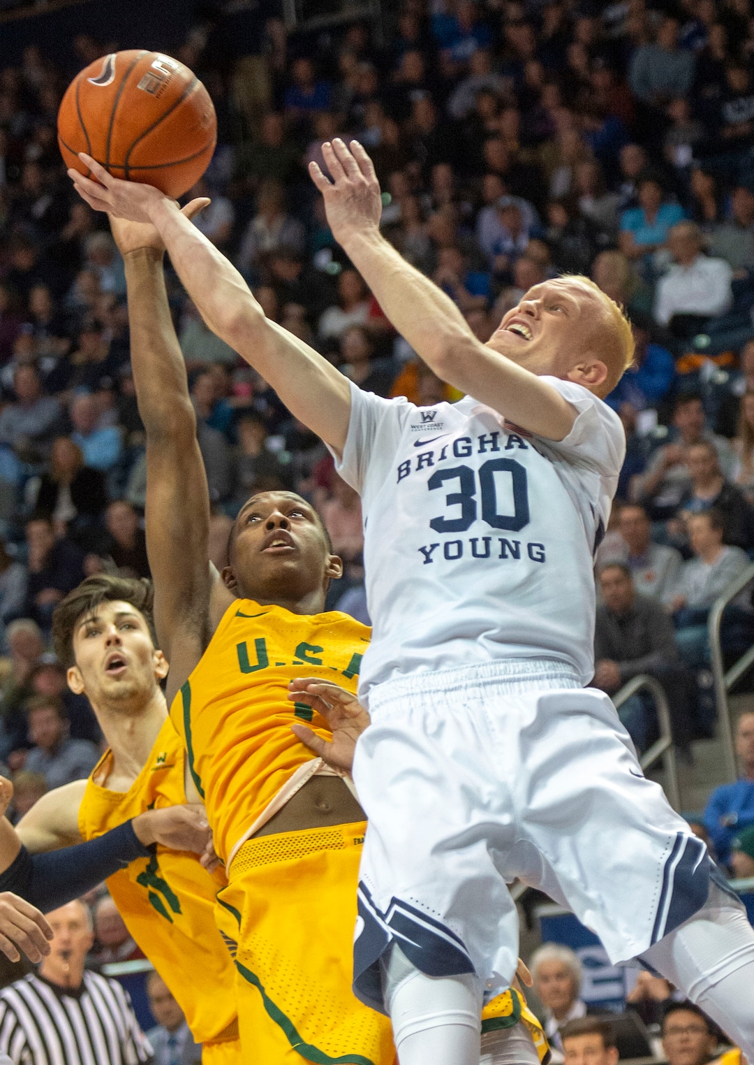(Rick Egan  |  The Salt Lake Tribune)  Brigham Young Cougars guard TJ Haws (30) takes a shot as San Francisco Dons guard Jamaree Bouyea (1), in WCC basketball action at the Marriott Center, Thursday, February 21, 2018.