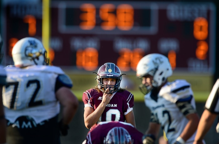 Scott Sommerdorf   |  The Salt Lake Tribune  Jordan QB Crew Wakley yells instructions prior to the snap during first half play. Jordan led Desert Hills 21-0 at the half, Friday, August 19, 2016. 