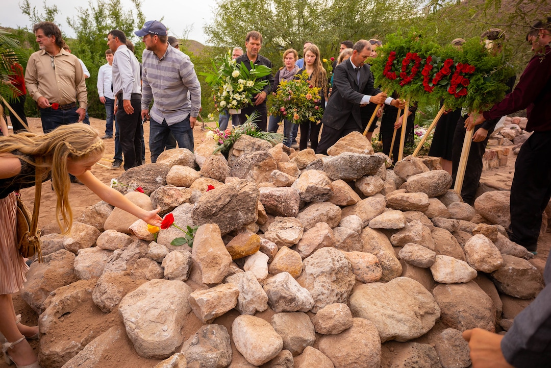 (Trent Nelson  |  The Salt Lake Tribune)
Family members put flowers on the grave after the funeral for Dawna Langford and two of her children, Trevor and Rogan, in La Mora, Sonora on Thursday, Nov. 7, 2019.