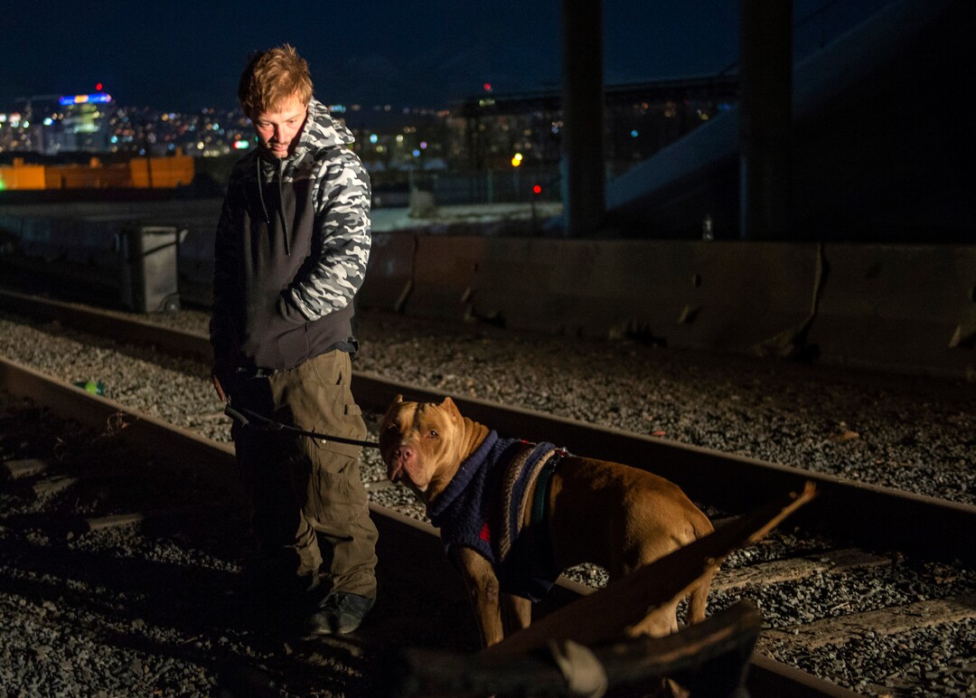 (Rick Egan | The Salt Lake Tribune)  Michael Zufelt with his dog Cerberus, is camping under the freeway after being moved from the Rio Grande area earlier this week, Saturday, Dec. 12, 2020.