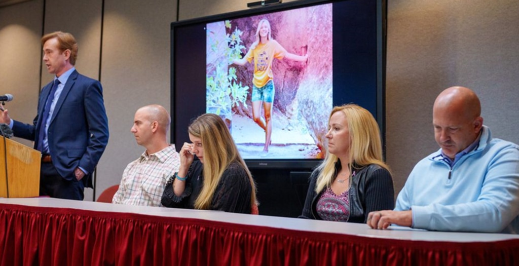 (The Times-Independent) Gabby Petito’s mother, Nichole Schmidt, wipes away a tear during a press conference held in November 2022. Petito’s father Joseph sits at the far right.