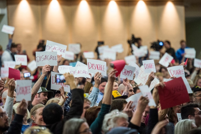Chris Detrick  |  The Salt Lake Tribune
Members of the audience hold up signs as U.S. Rep. Jason Chaffetz, R-Utah, speaks during the town-hall meeting in Brighton High School Thursday February 9, 2017. 