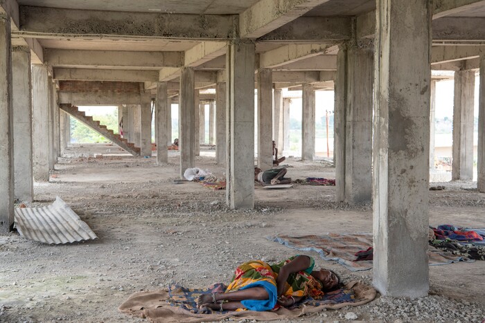 (Saumya Khandelwal | The New York Times) Rabita sleeps on a day off at the construction site where she and her husband both work and live in Lucknow, India, July 27, 2020. Around the world, the poor and marginalized are much more likely to be vulnerable to extreme heat; Rabita and her husband are Dalits, at the bottom of the Hindu caste ladder, working to pay off their debts.