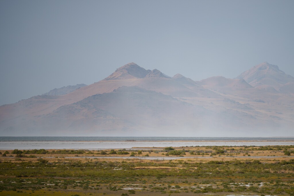 (Trent Nelson  |  The Salt Lake Tribune) Dust blows off the Great Salt Lake past Antelope Island on Saturday, Aug. 24, 2024.