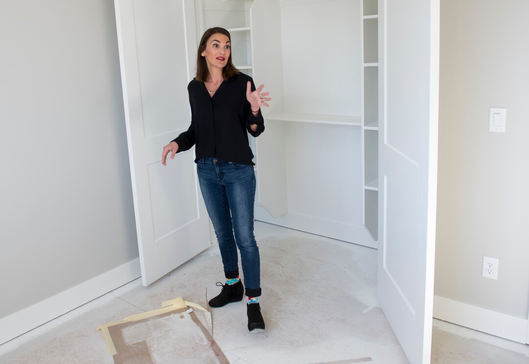 (Rick Egan  |  The Salt Lake Tribune)    Myra Petersen, points out some of the features in a custom home in Riverton, Monday, Sept. 24, 2018.