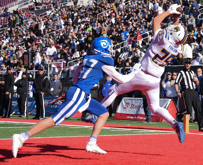 (Francisco Kjolseth  |  The Salt Lake Tribune)  Brinton Paulson of Orem pulls in a touchdown over Dixie's Harrison Beazer as they compete in the 4A high school championship game at Rice Eccles Stadium in Salt Lake City, Friday, Nov. 16, 2018.