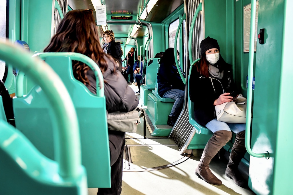 (Claudio Furlan | Lapresse via AP)  A woman wearing a sanitary mask sits in a streetcar in Milan, Italy, Monday, Feb. 24, 2020. At least 190 people in Italy’s north have tested positive for the COVID-19 virus and four people have died, including an 84-year-old man who died overnight in Bergamo, the Lombardy regional government reported.