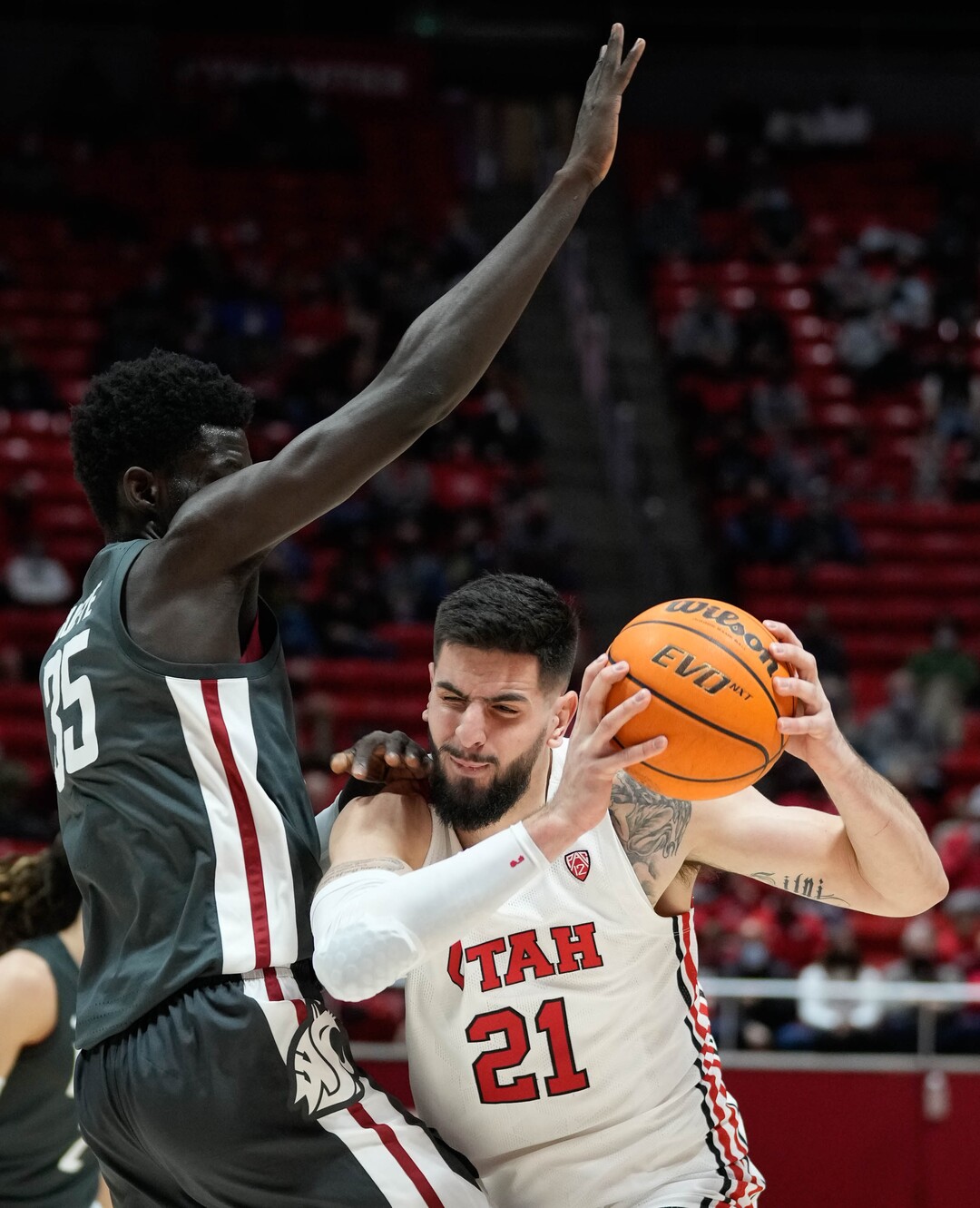(Francisco Kjolseth | The Salt Lake Tribune) Washington State Cougars forward Mouhamed Gueye (35) pressures Utah Utes forward Dusan Mahorcic (21) in game action during an NCAA college basketball game at the Jon M.Huntsman Center, on Saturday, Jan. 8, 2022. Utah lost 61-77.