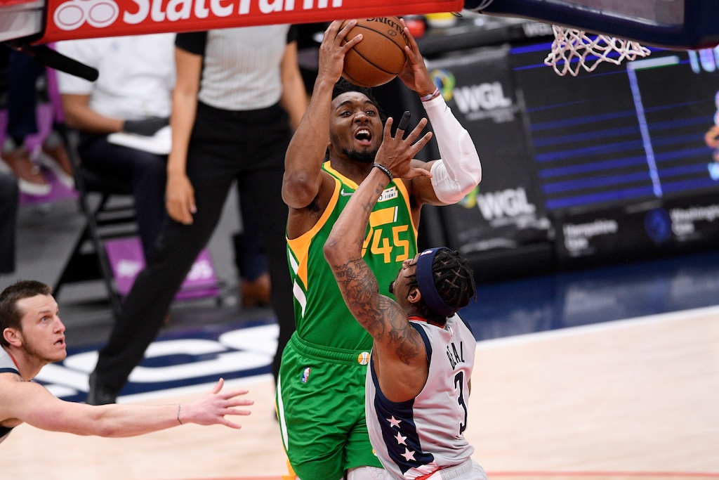 Utah Jazz guard Donovan Mitchell (45) goes to the basket against Washington Wizards guard Bradley Beal (3) during the first half of an NBA basketball game, Thursday, March 18, 2021, in Washington. (AP Photo/Nick Wass)