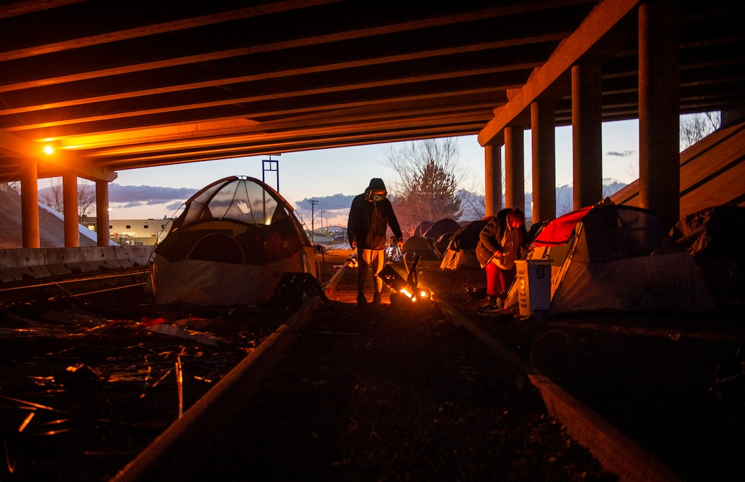 (Rick Egan | The Salt Lake Tribune) Homeless seek shelter under the freeway after being moved from the Rio Grande area earlier this week, Saturday, Dec. 12, 2020.