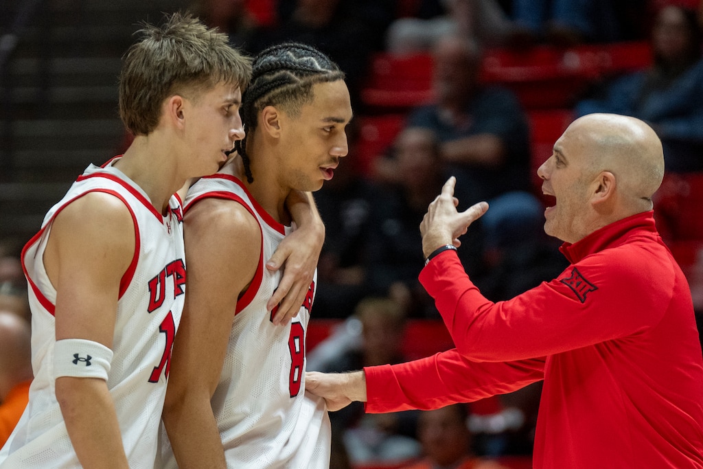 (Rick Egan | The Salt Lake Tribune) Utah Utes head coach talks to Utah Utes forward Keanu Dawes (8) and Utah Utes forward Jake Wahlin (10)During a break in the action, in Big 12 basketball action between the Utah Utes and the Oklahoma State Cowboys at the Jon M. Huntsman Center, on Saturday, Jan 11, 2025.