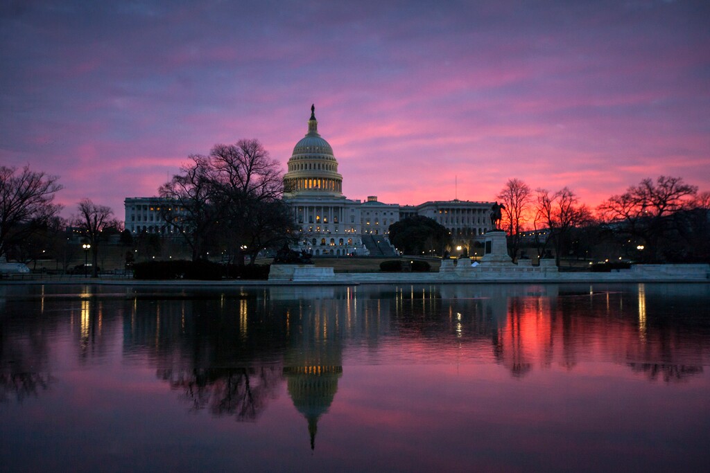 (J. Scott Applewhite | AP file photo)  In this Feb. 6, 2018 photo, dawn breaks over the Capitol in Washington.
