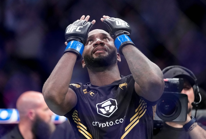 (Francisco Kjolseth | The Salt Lake Tribune) UFC fighter Leon Edwards, of Jamaica, celebrates his title as welterweight champion of the world after knocking out Nigerian UFC fighter Kamaru Usman during the UFC 278 mixed martial arts title bout in Salt Lake City on Saturday, Aug. 20, 2022.