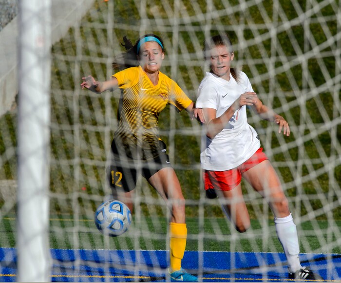 (Steve Griffin | The Salt Lake Tribune) East's Erin Bridges, left, battles Maple Mountain's Madisyn Frischknecht during the 5A semifinal girl's soccer match at Juan Diego High School in Draper Tuesday October 17, 2017.