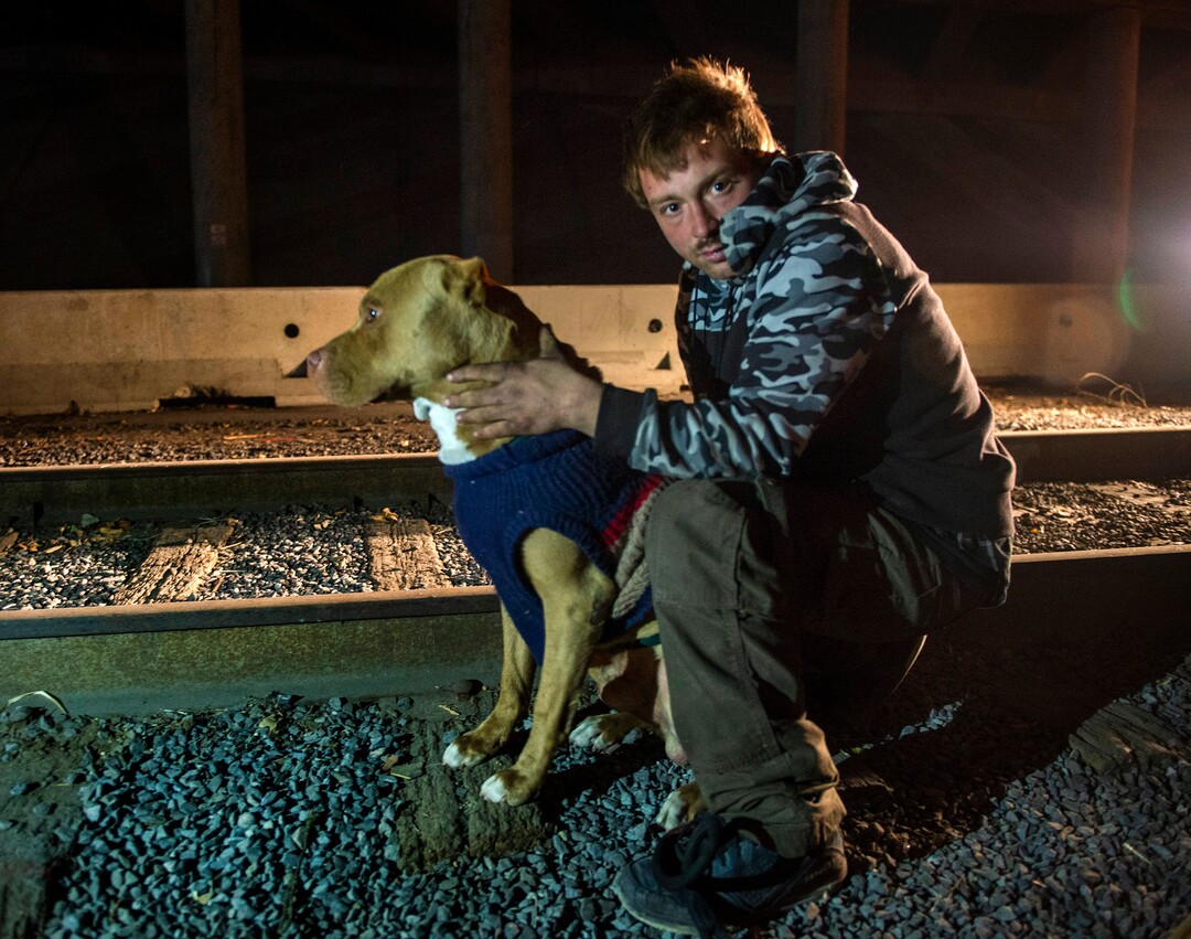 (Rick Egan | The Salt Lake Tribune)  Michael Zufelt with his dog Cerberus, is camping under the freeway after being moved from the Rio Grande area earlier this week, Saturday, Dec. 12, 2020.