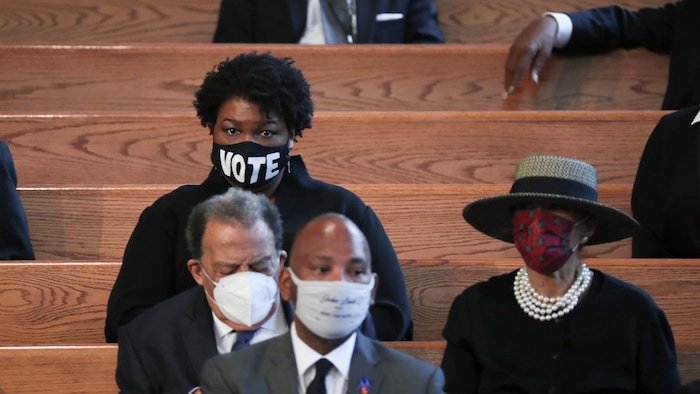 Stacey Abrams, center left, waits for the program to start at the funeral service for the late Rep. John Lewis, D-Ga., at Ebenezer Baptist Church in Atlanta, Thursday, July 30, 2020.  (Alyssa Pointer/Atlanta Journal-Constitution via AP, Pool)