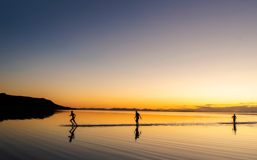 (Rick Egan | The Salt Lake Tribune) Greg Carr, Sam Rushforth and Austin Wintle from Centerville, UT, head back to the shore after floating in the Great Salt Lake. Wednesday, Sept. 18, 2019.