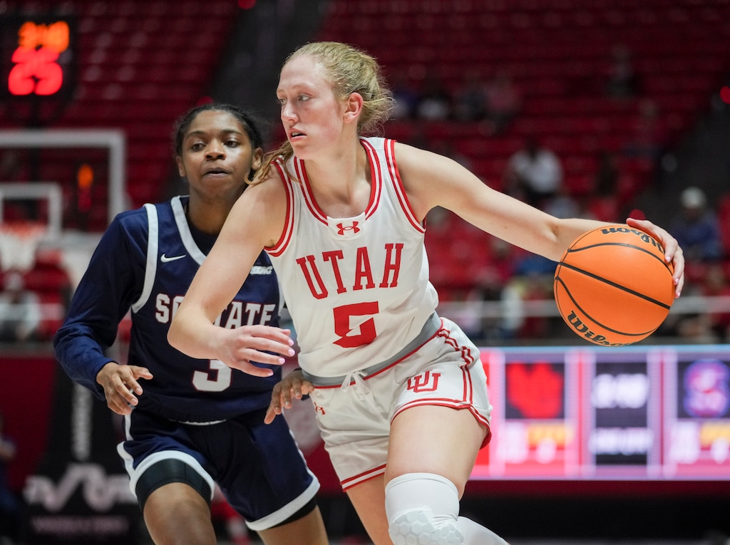 (Bethany Baker  |  The Salt Lake Tribune) Utah Utes guard Gianna Kneepkens (5) drives past South Carolina State Lady Bulldogs guard Morgan Beacham (3) at the Jon M. Huntsman Center on Thursday, Nov. 9, 2023.