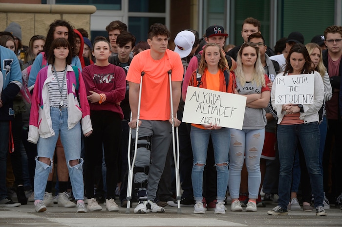 (Al Hartmann  |  The Salt Lake Tribune) 	
About 80 students at Westlake High School in Saratoga Springs left class and stood together in silence at the front entrance of the school Wednesday March 14, 2018 to remember the 17 students who died in a school shooting in Florida.  They held posters of the names of those killed. 