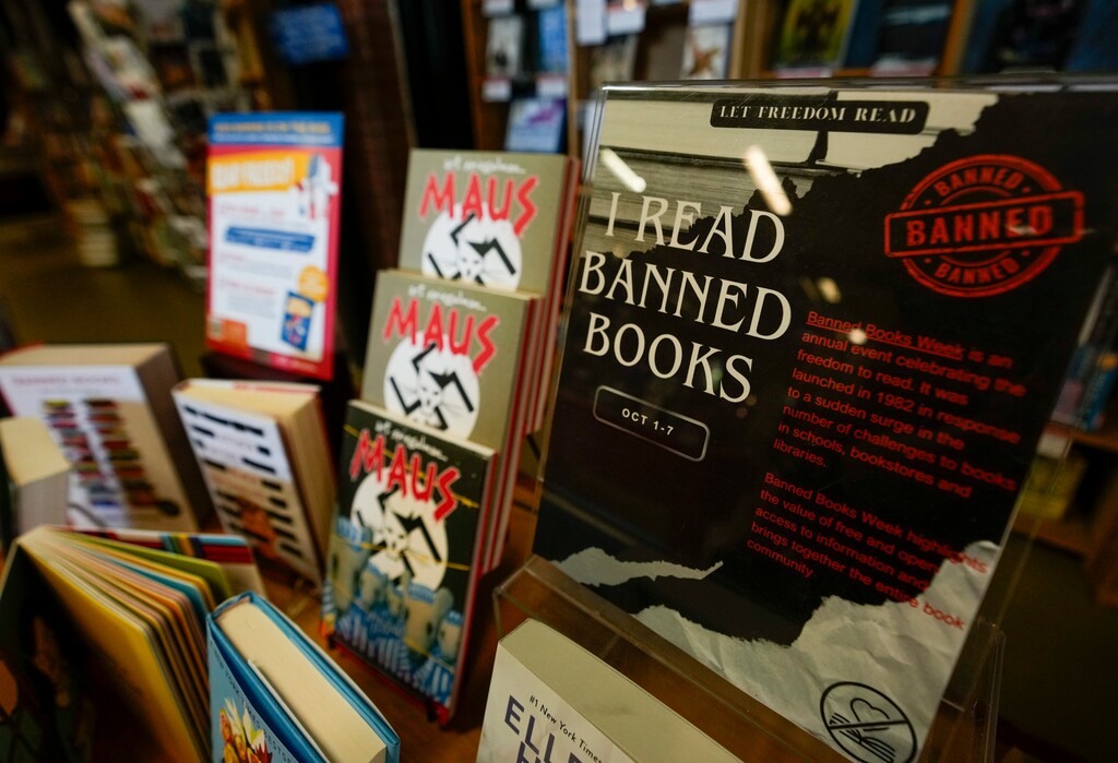 (Bethany Baker | The Salt Lake Tribune) Various banned books are displayed on a table in Weller Book Works in Trolley Square for Banned Book Week in Salt Lake City on Thursday, Oct. 5, 2023. A proposed bill could make public school employees subject to misdemeanor charges if they keep materials deemed “objectively sensitive” available to students.