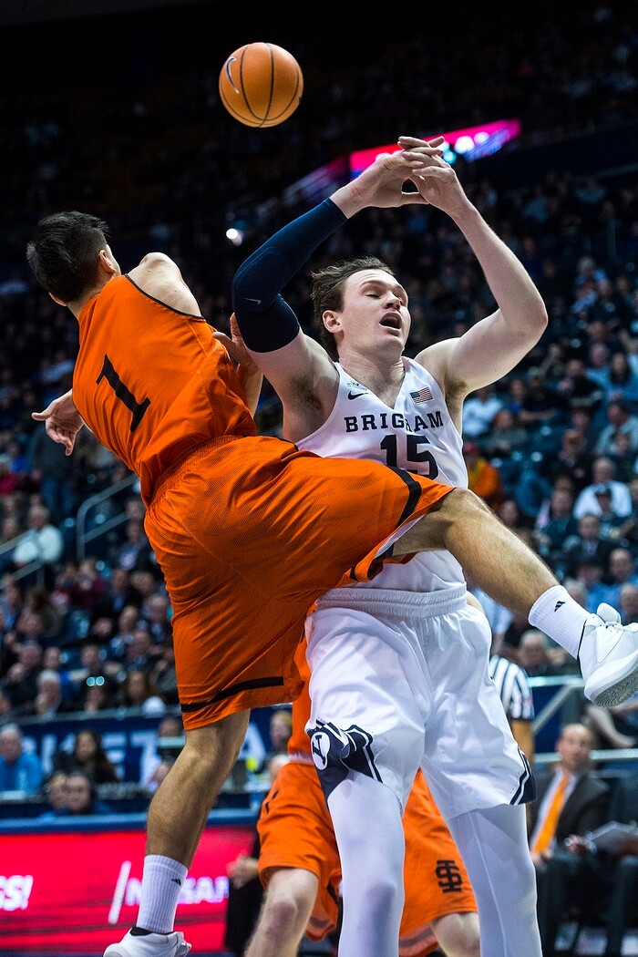 (Chris Detrick  |  The Salt Lake Tribune)  Idaho State Bengals guard Geno Luzcando (1) and Brigham Young Cougars forward Payton Dastrup (15) go for the ball during the game at the Marriott Center Thursday, December 21, 2017.  