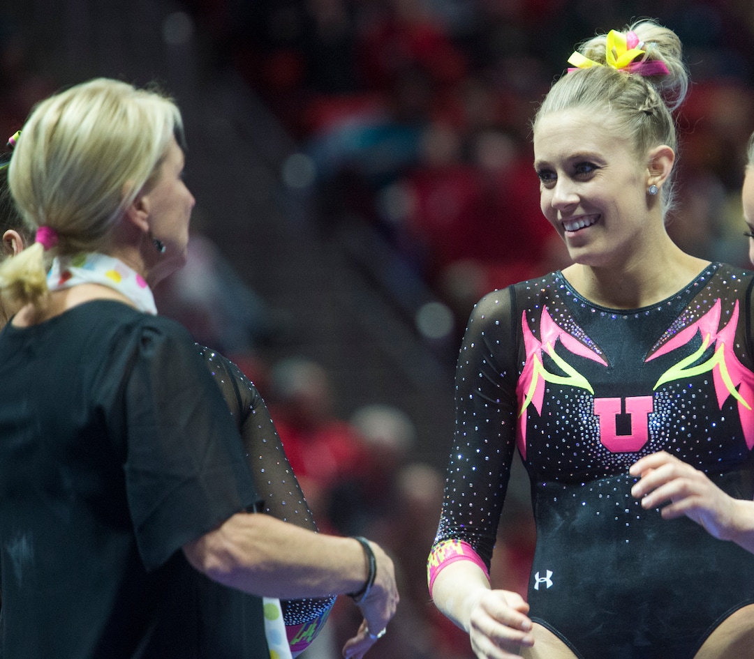 (Rick Egan  |  The Salt Lake Tribune)   Team mates congratulate MaKenna Merrell-Giles after her performance on the beam for Utah, in Gymnastics action Utah vs. Oregon State at the Jon M. Huntsman Center, Friday, January 19, 2018.
