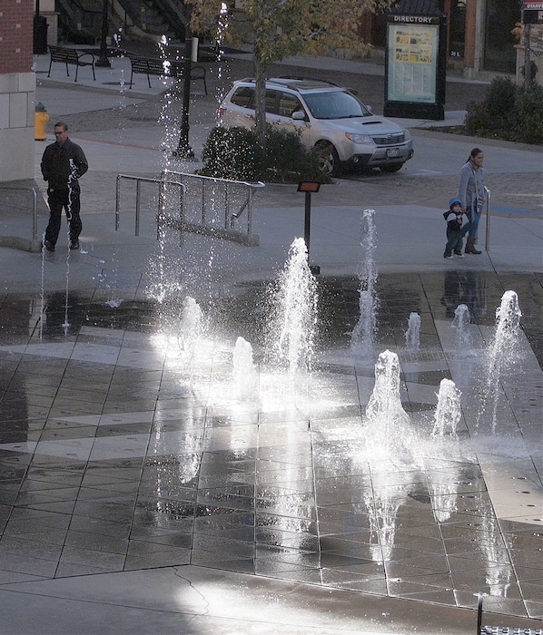 Al Hartmann | The Salt Lake Tribune
Shoppers pass by the fountain a The Gateway in Salt Lake City.