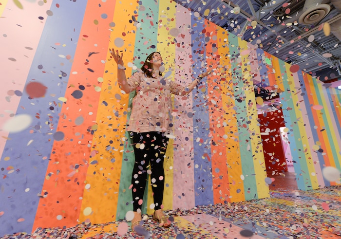 (Francisco Kjolseth  |  The Salt Lake Tribune) Marci Monson throws paper confetti in the cereal room during a visit to Hall of Breakfast, a quirky new art exhibit that celebrates the first meal of the day.
